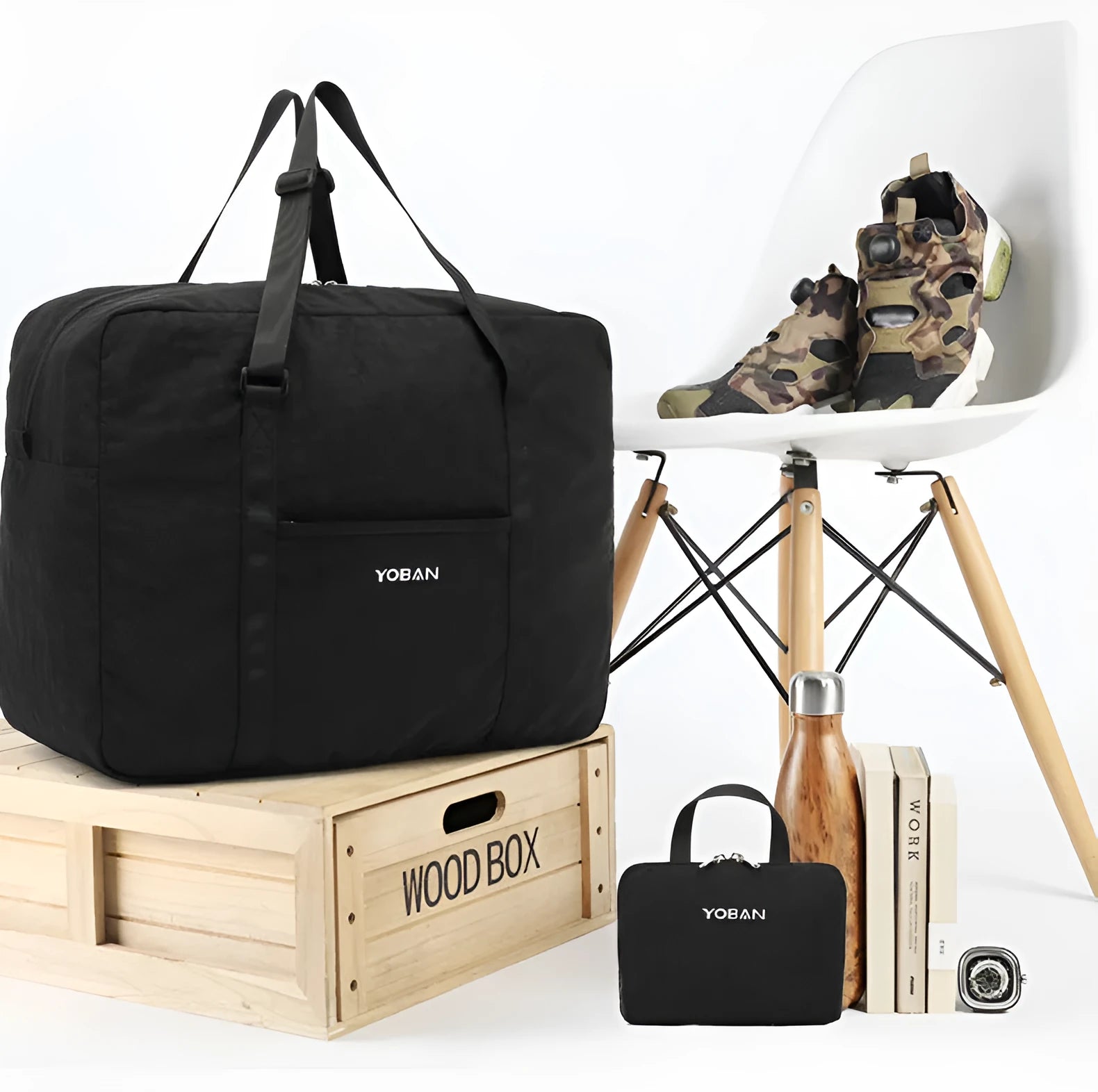 Large waterproof foldable travel bag in black with 20-35L capacity and zipper closure