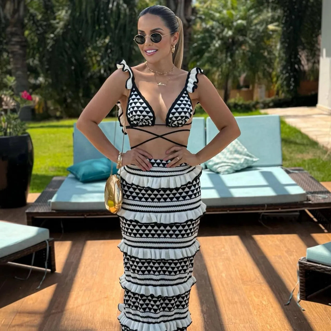 Women's black and white striped cotton bikini set with ruffled top and long knitted skirt