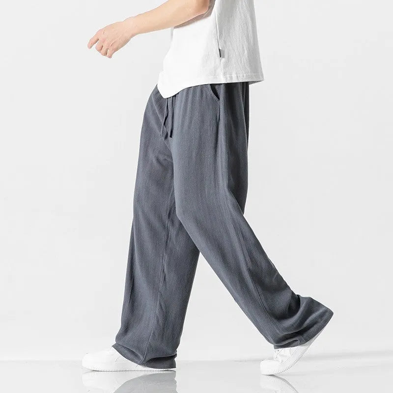 Men's straight-leg casual trousers in beige bamboo fibre fabric with a drawstring waist.