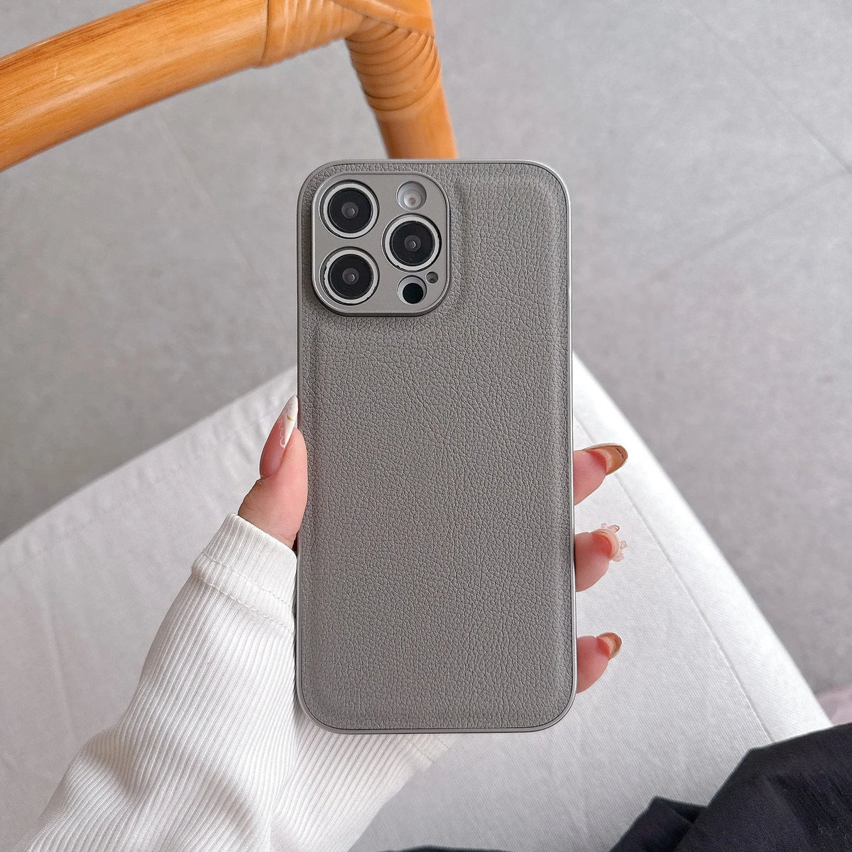 Lychee pattern imitation leather phone case for iPhone 16 Pro Max in gold colour with textured finish