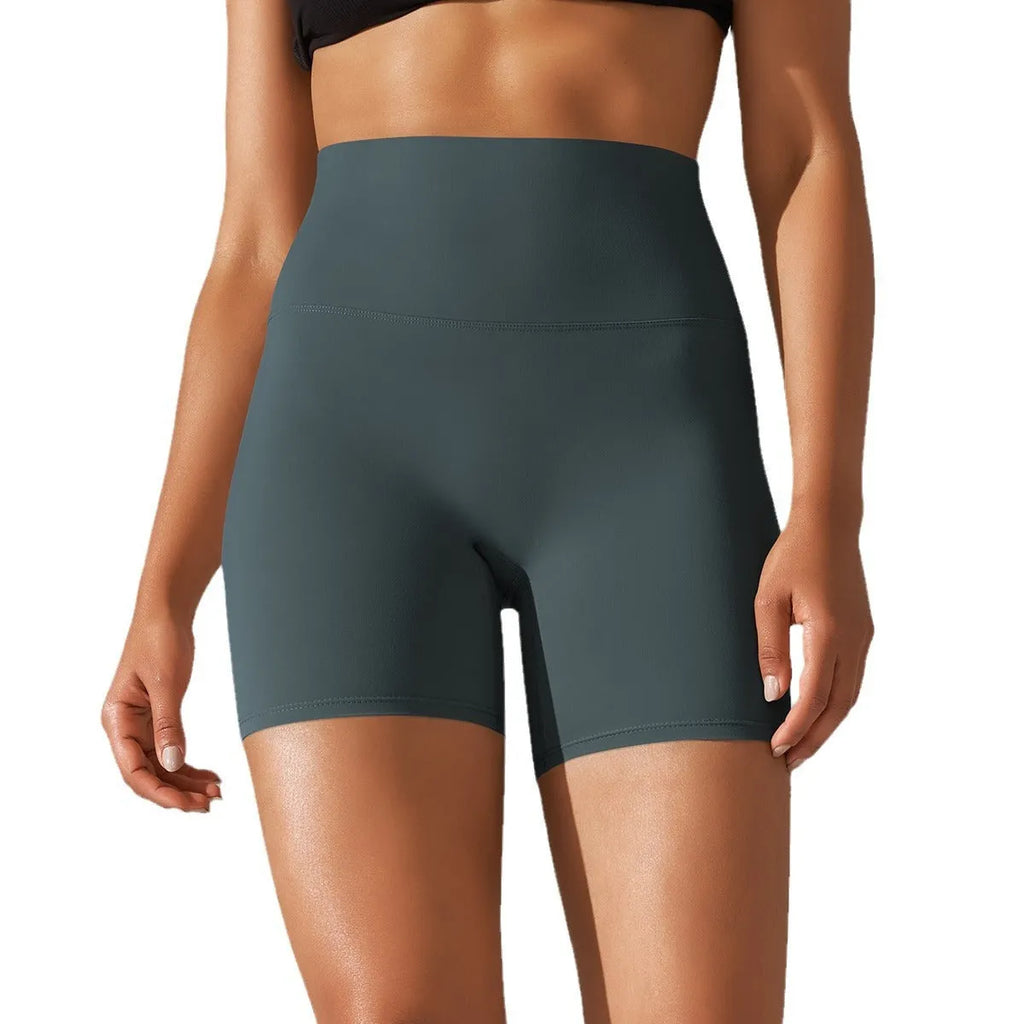 Women's high waist hip lift fitness tights in moisture-wicking fabric for gym and daily wear