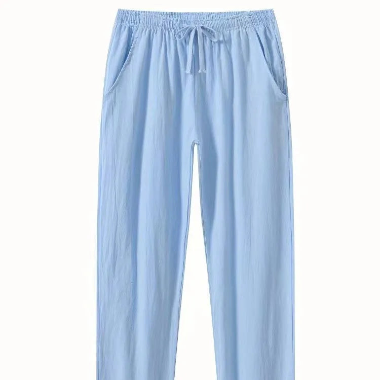 Men's loose-fit cotton beach trousers in solid white, sky blue, khaki, or black colours.