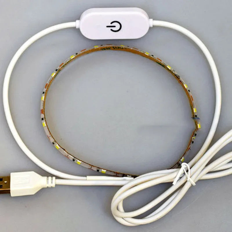 Photon flexible USB LED light strip bent into a curve showing its 60 small white LED beads.