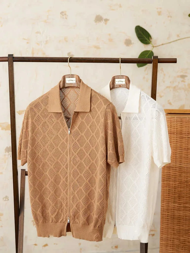 Light brown cotton short sleeve cardigan with a front zipper and lapel collar laid flat.