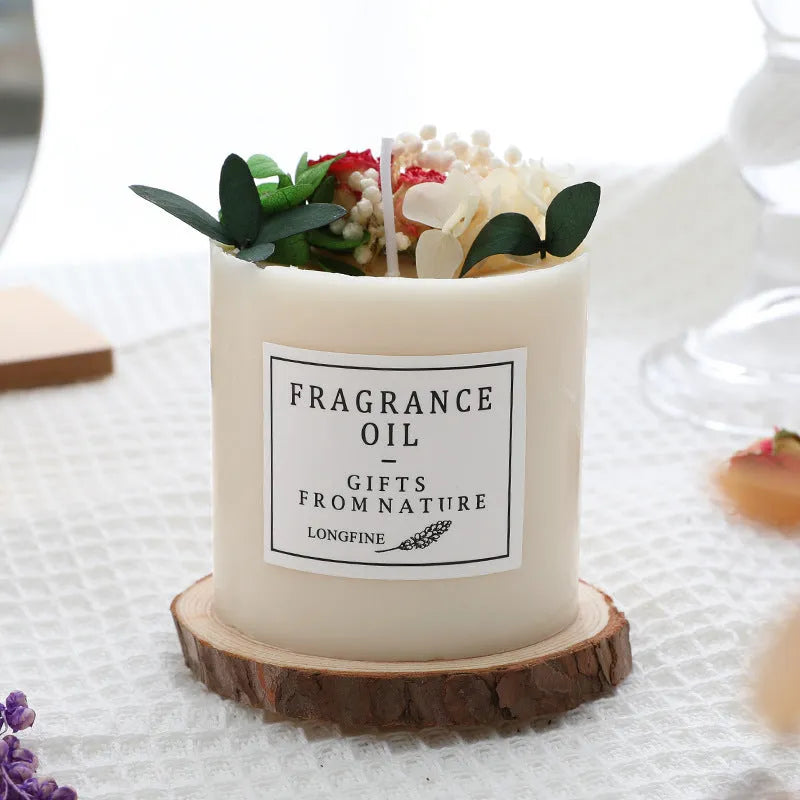 Aromatherapy candle with dried flowers on surface, shown in gift box with chip base.