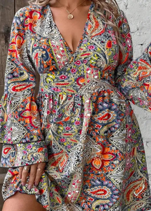 Women's plus size Bohemian style dress with V-neck, long bell sleeves, and an A-line short skirt in a solid colour.