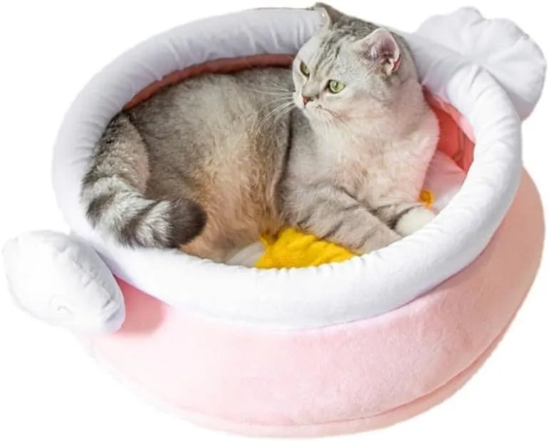 Pink honey pot shaped cat bed with a removable circular cushion inside for a small pet.