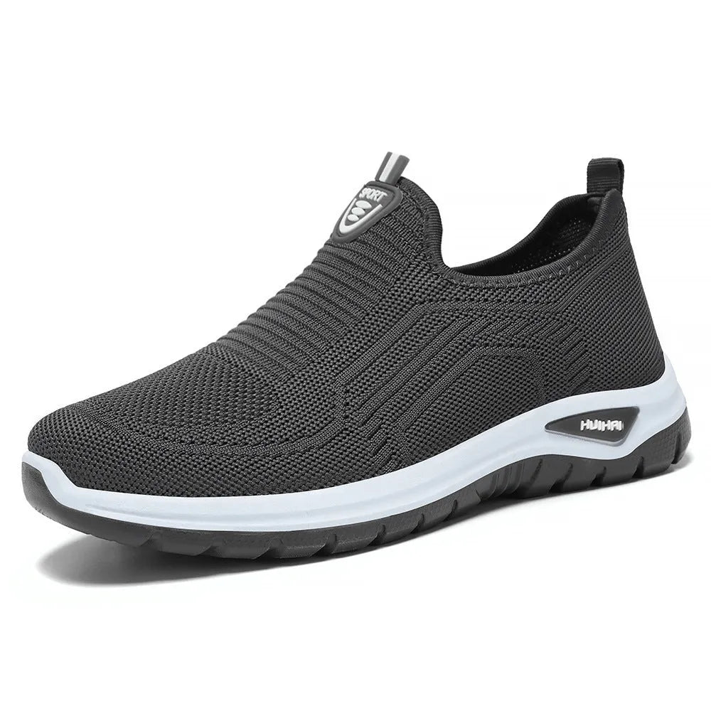 Men's black and grey breathable casual shoes with mesh uppers and PVC soles in a round-toe tennis style.