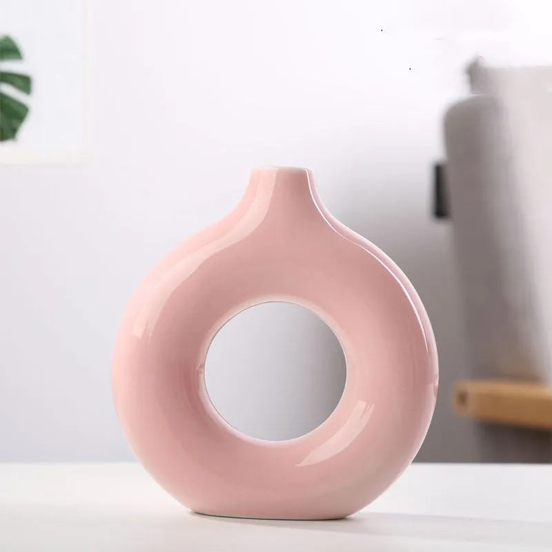 Unglazed porcelain biscuit vase with frosted particle surface in neutral colour