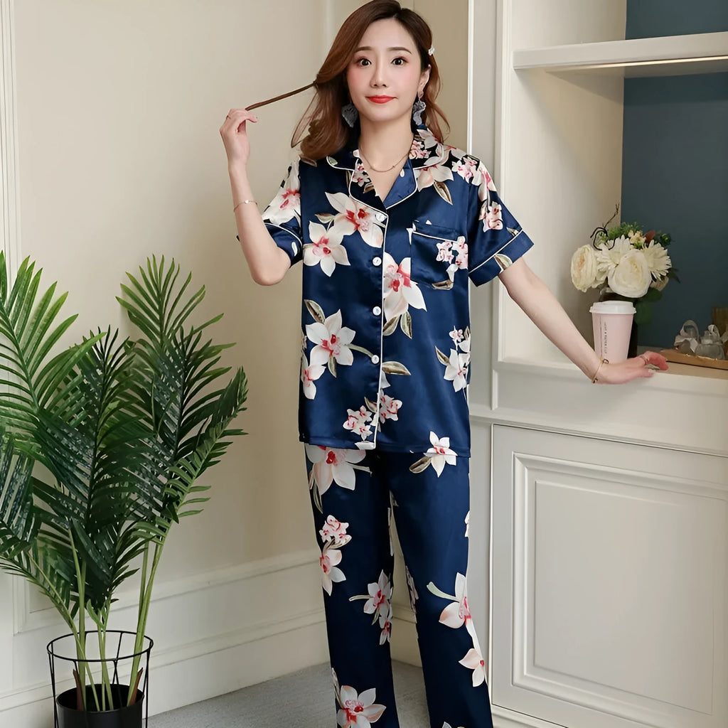 Women's two-piece short-sleeved pyjama set in begonia print with trousers, shown on a model
