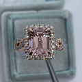 Rose gold geometric alloy ring on a plain background, showing its shape and electroplated finish.