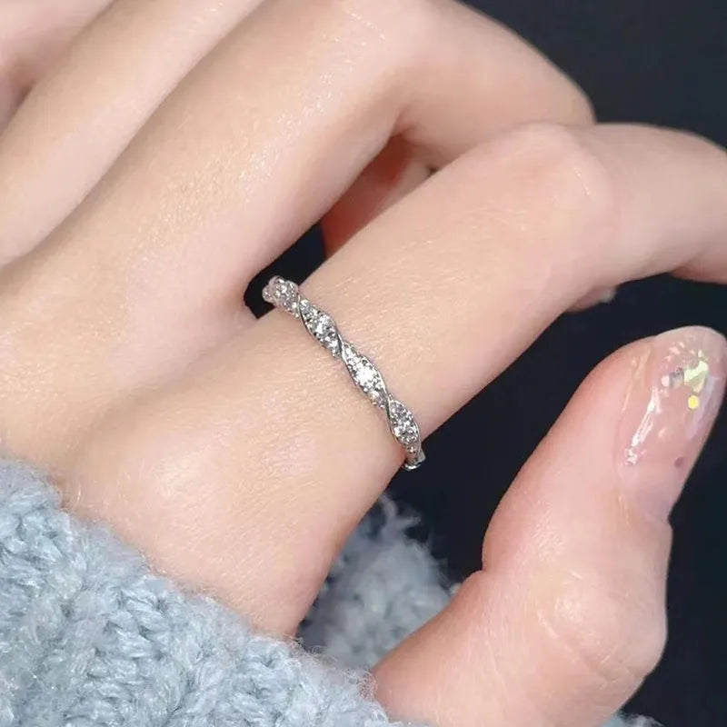 S999 sterling silver winding love ring in white gold colour with inlaid zircon for women