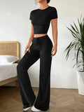 Black polyester women's suit set with high waist trousers and short sleeve t-shirt