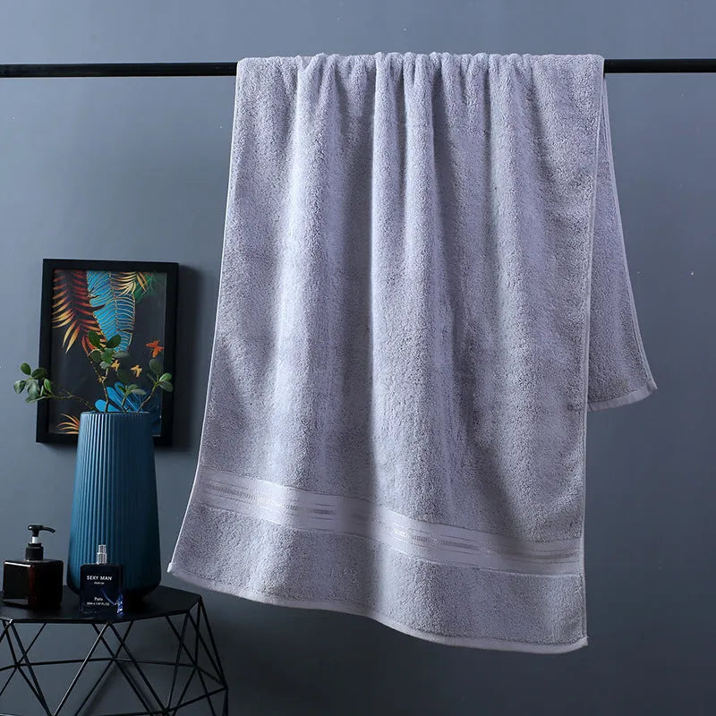 Three-piece cotton bath towel set in floral colours showing bath towel, hand towel and face cloth with optional logo printing