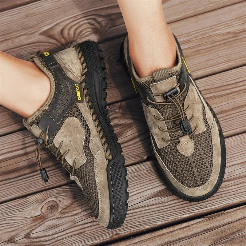 Men's brown suede low-top casual tennis shoes with a visible elastic band and hand-stitched rubber sole.