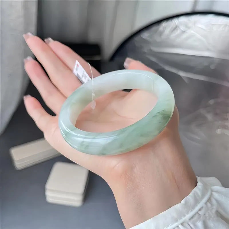Tian Shan Cui jade bracelet with floating flower design and zodiac animal modelling in children's style