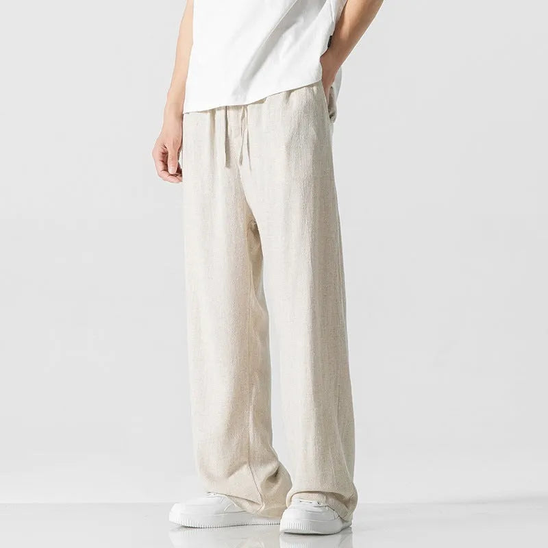 Men's straight-leg casual trousers in beige bamboo fibre fabric with a drawstring waist.