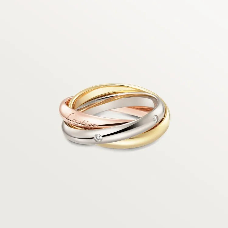 A pair of silver couple rings with a full diamond setting and U-shaped geometric design on a grey background.