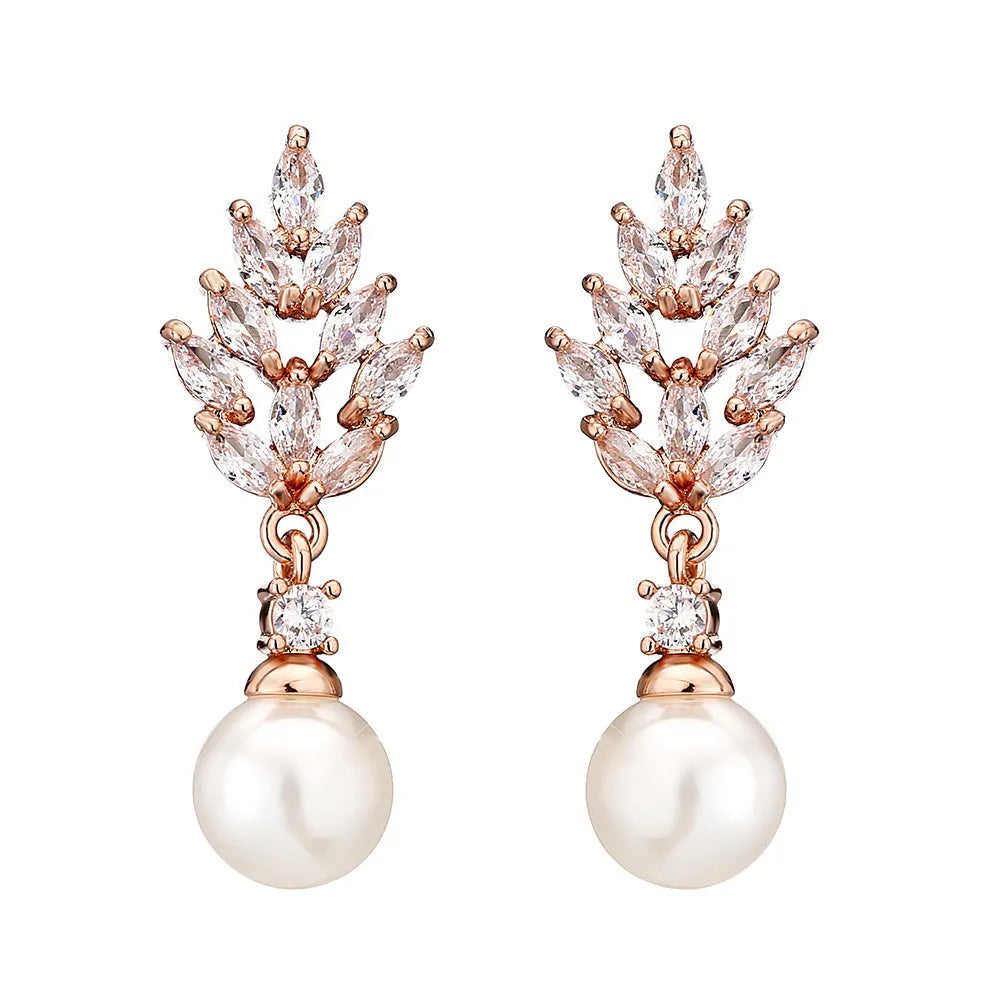 Gold, platinum, and rose gold plated geometric flower earrings with micro-inlaid zircon and pearl details.