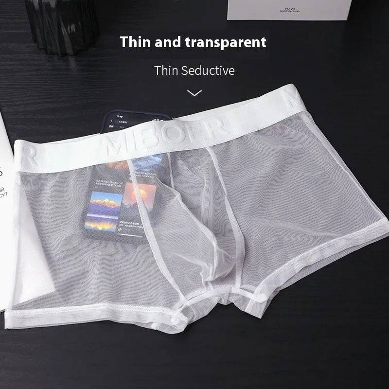 Men's thin invisible boxer shorts in quick-drying polyester fabric on a colour swatch showing black, white, blue, green, pink, and beige.