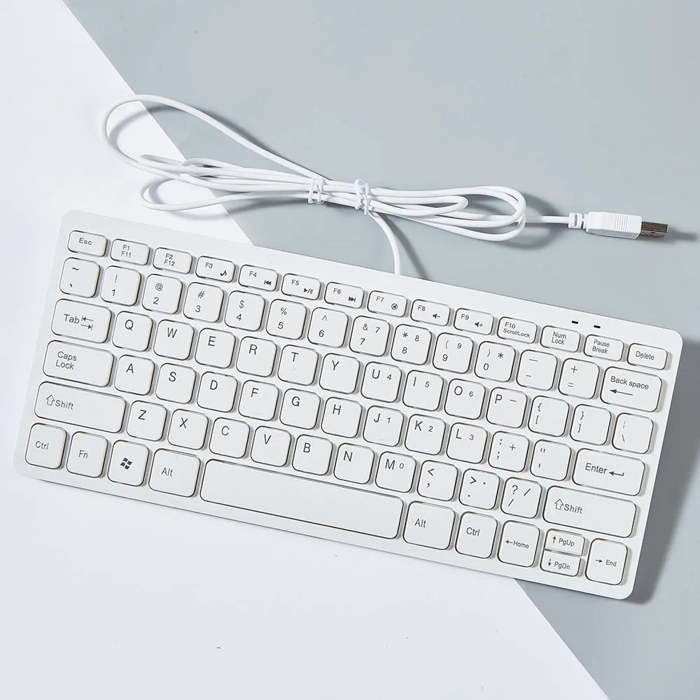 Mini USB wired keyboard for laptops in black, white, pink, or blue colours with 1.3 metre cable