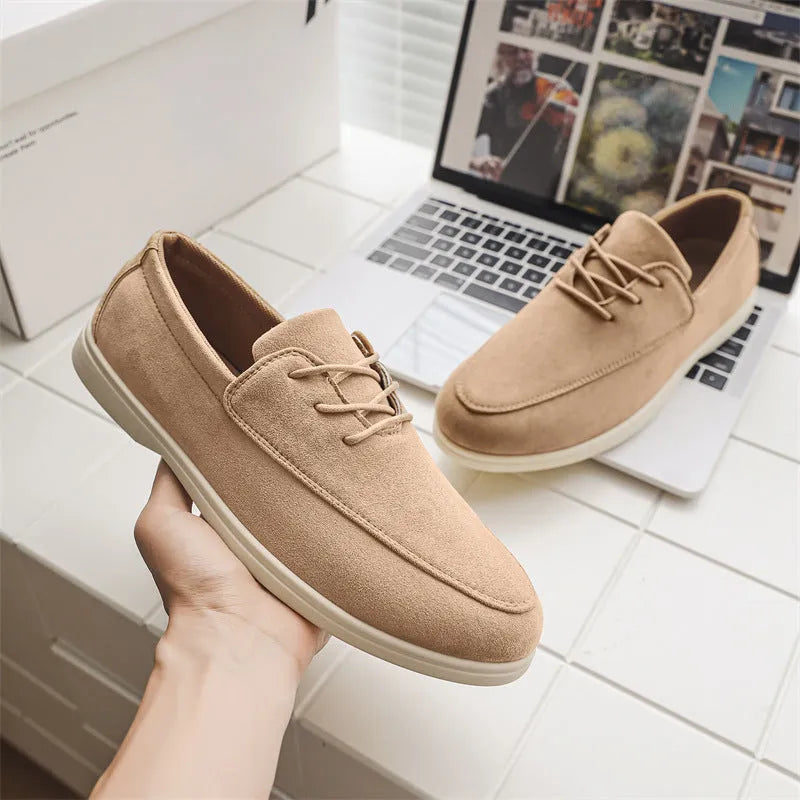 Men's slip-on suede loafers in beige with elastic band and rubber sole, side view