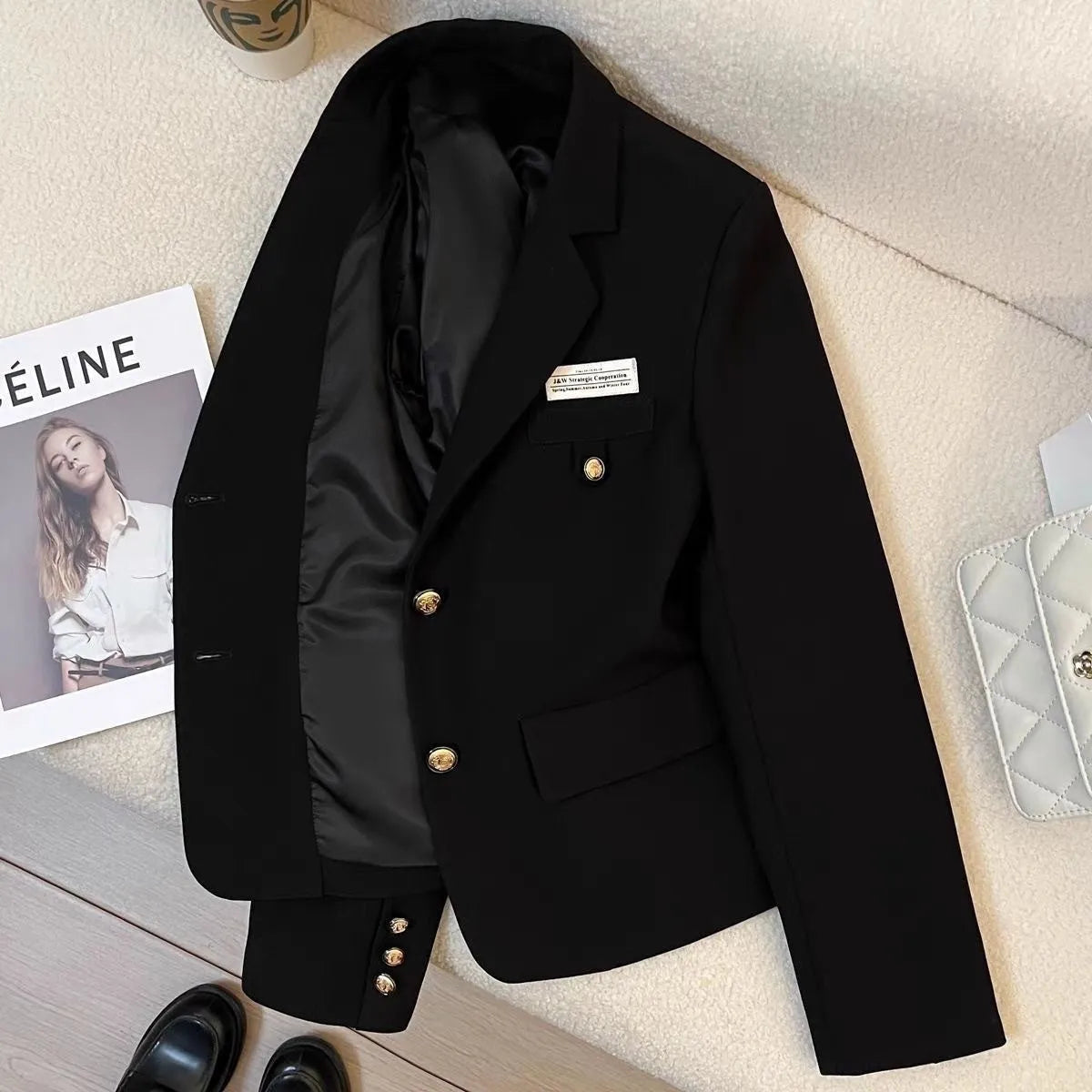 Women's black short suit coat loose fit polyester long sleeves pocket detail solid colour