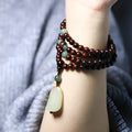Rosewood beaded bracelet with 108 6mm beads and carved Hotian jade pendant centrepiece