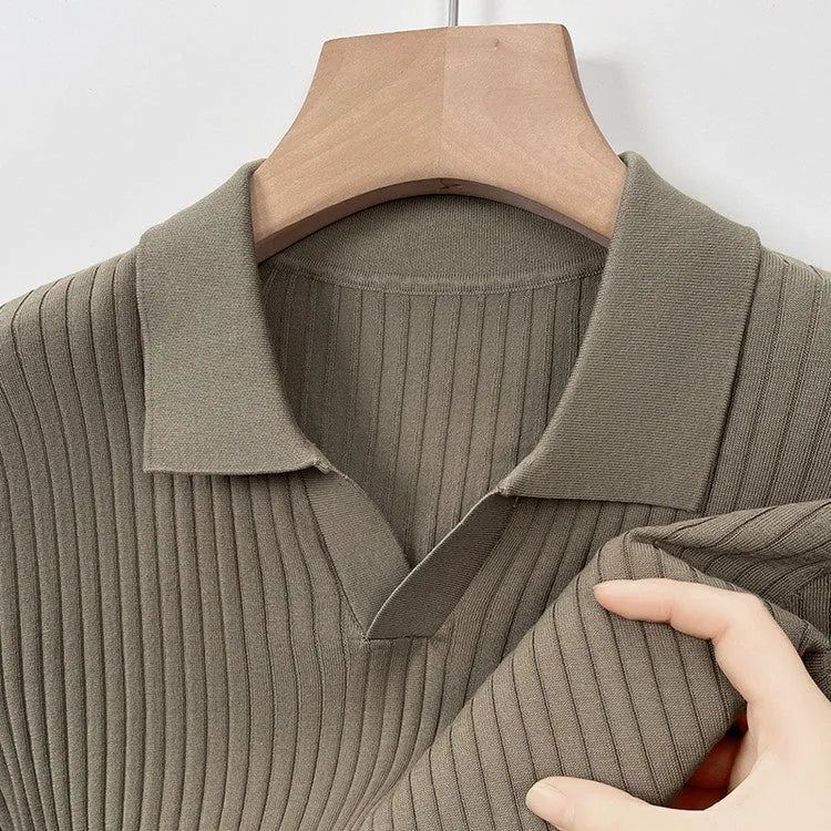 Man wearing a striped mulberry silk T-shirt with a short sleeve and lapel collar.