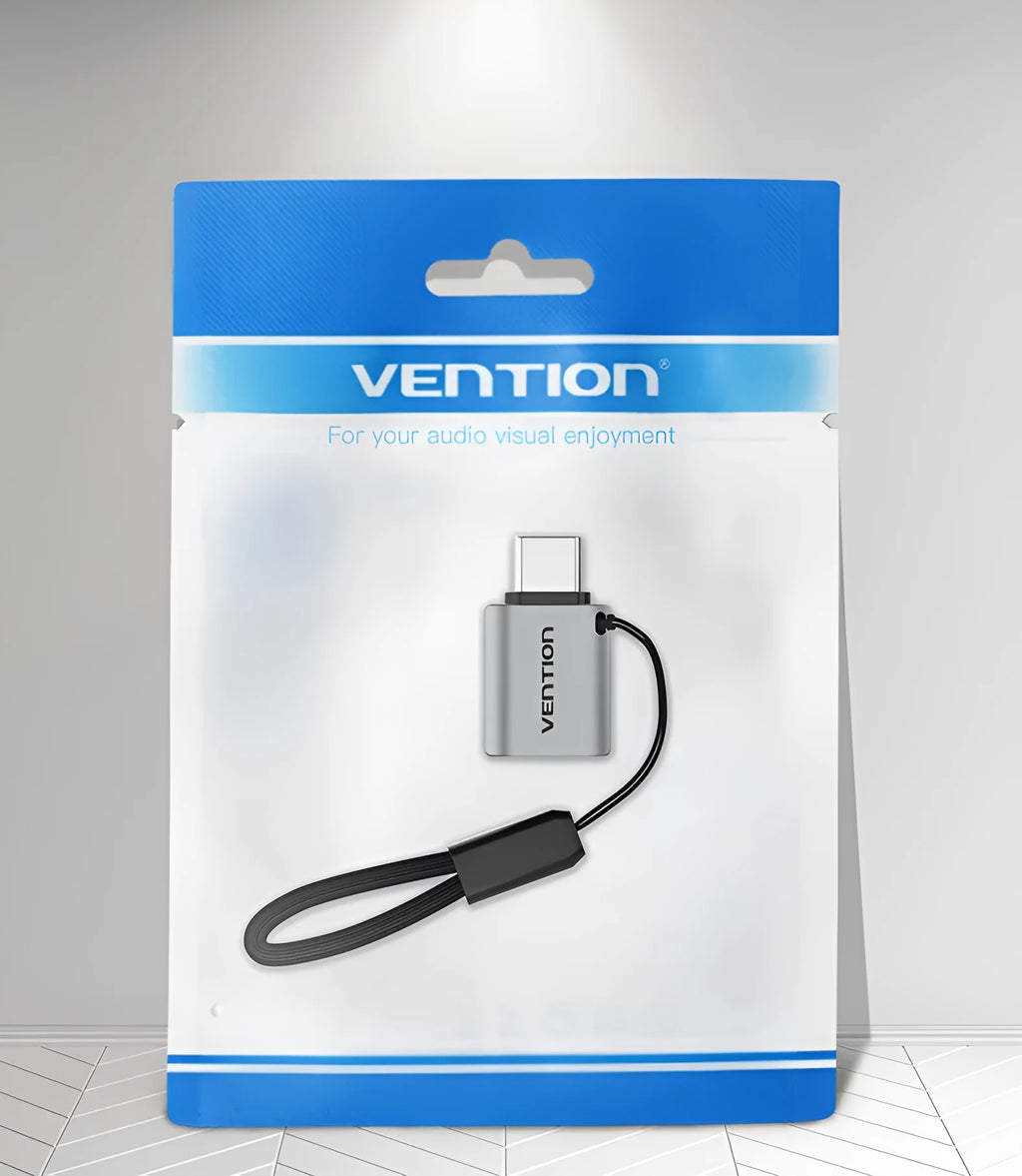 Grey aluminium USB 3.0 OTG adapter with USB-C male and USB-A female connectors and a lanyard.