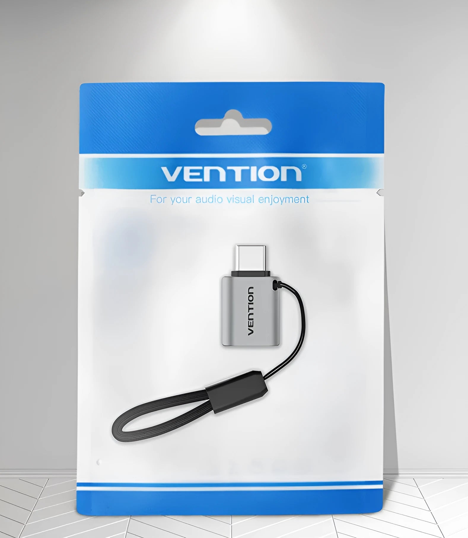 Grey aluminium USB 3.0 OTG adapter with USB-C male and USB-A female connectors and a lanyard.