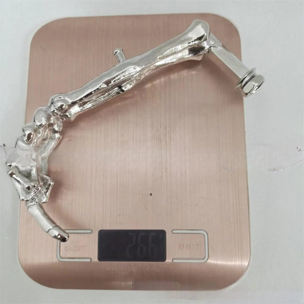 Alloy motorcycle support frame bracket fittings 15x7.5x3cm on solid background