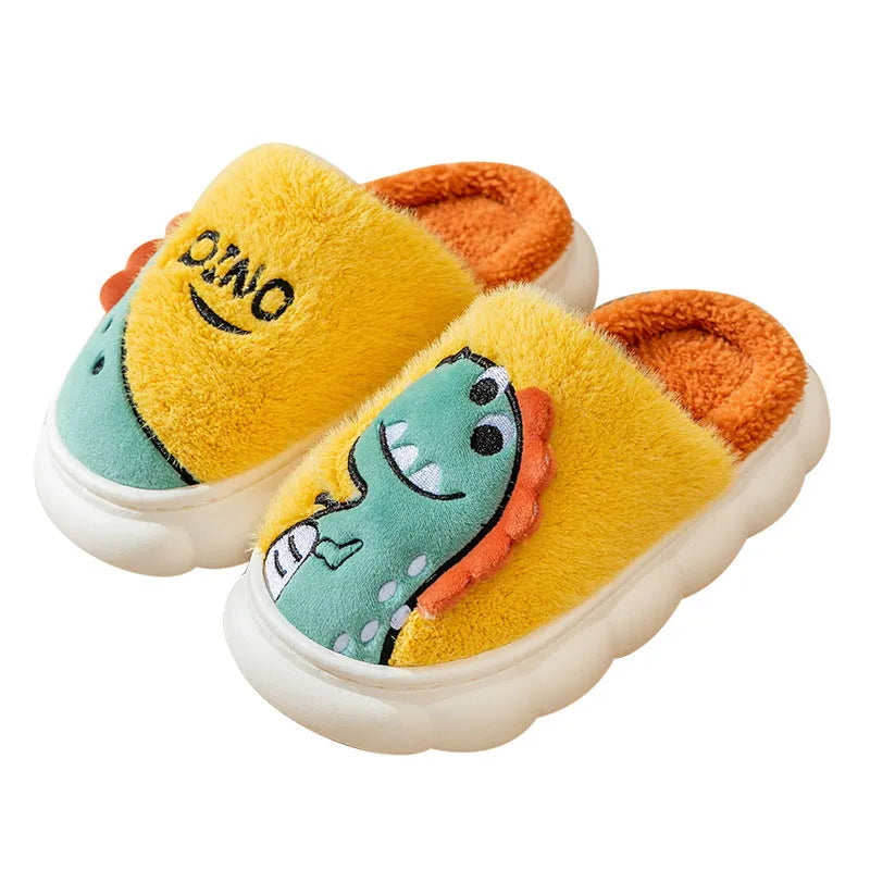 A pair of plush grey dinosaur-themed couple slippers with a thick sole, shown next to coffee and orange colour variants.