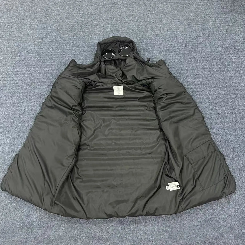 Men's loose hooded cotton vest jacket in black, side view, showing hood and zip closure