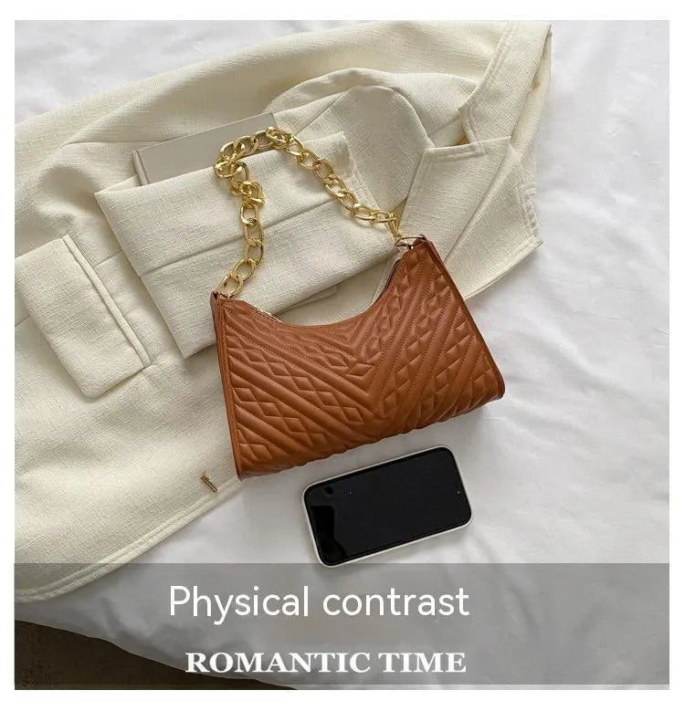 Brown PU pleated chain baguette shoulder bag showing vertical square shape and soft carry handle.