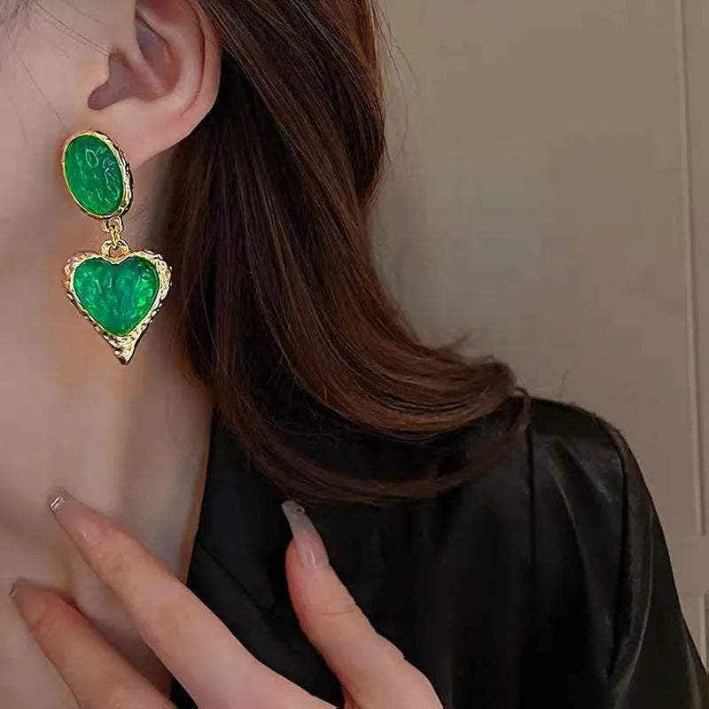 Pleated oval love heart stud earrings in purple, red, green, and yellow white colours with butterfly backs