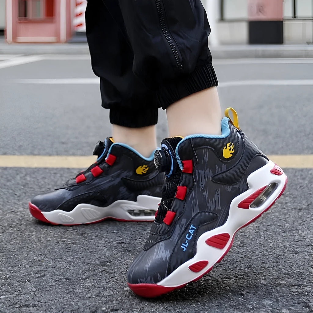 Children's rotating button running shoes in black with a cushion basketball design on a white PU sole.