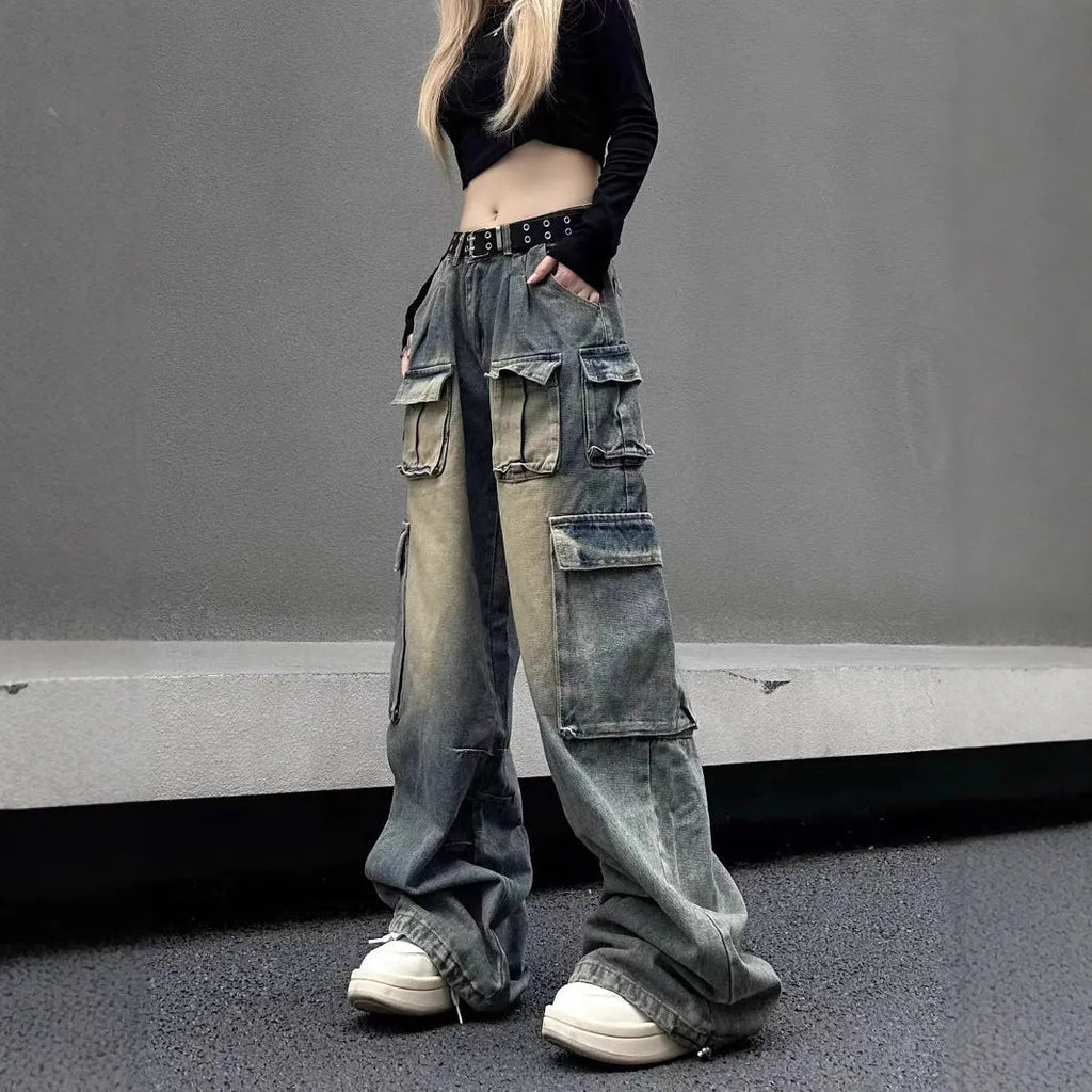Loose-fit distressed denim pants with multiple pockets in light blue wash, straight-leg street style