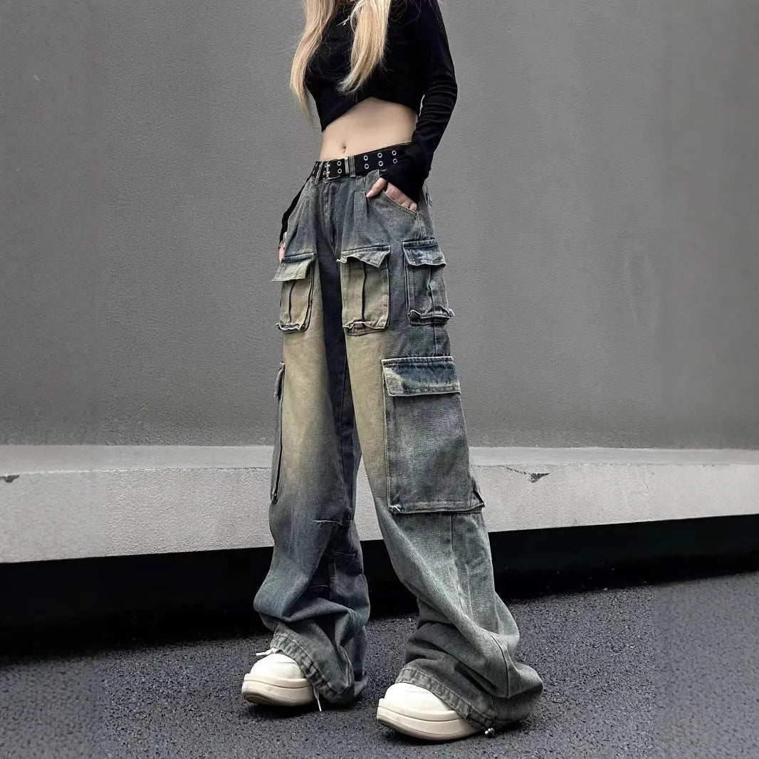 Loose-fit distressed denim pants with multiple pockets in light blue wash, straight-leg street style