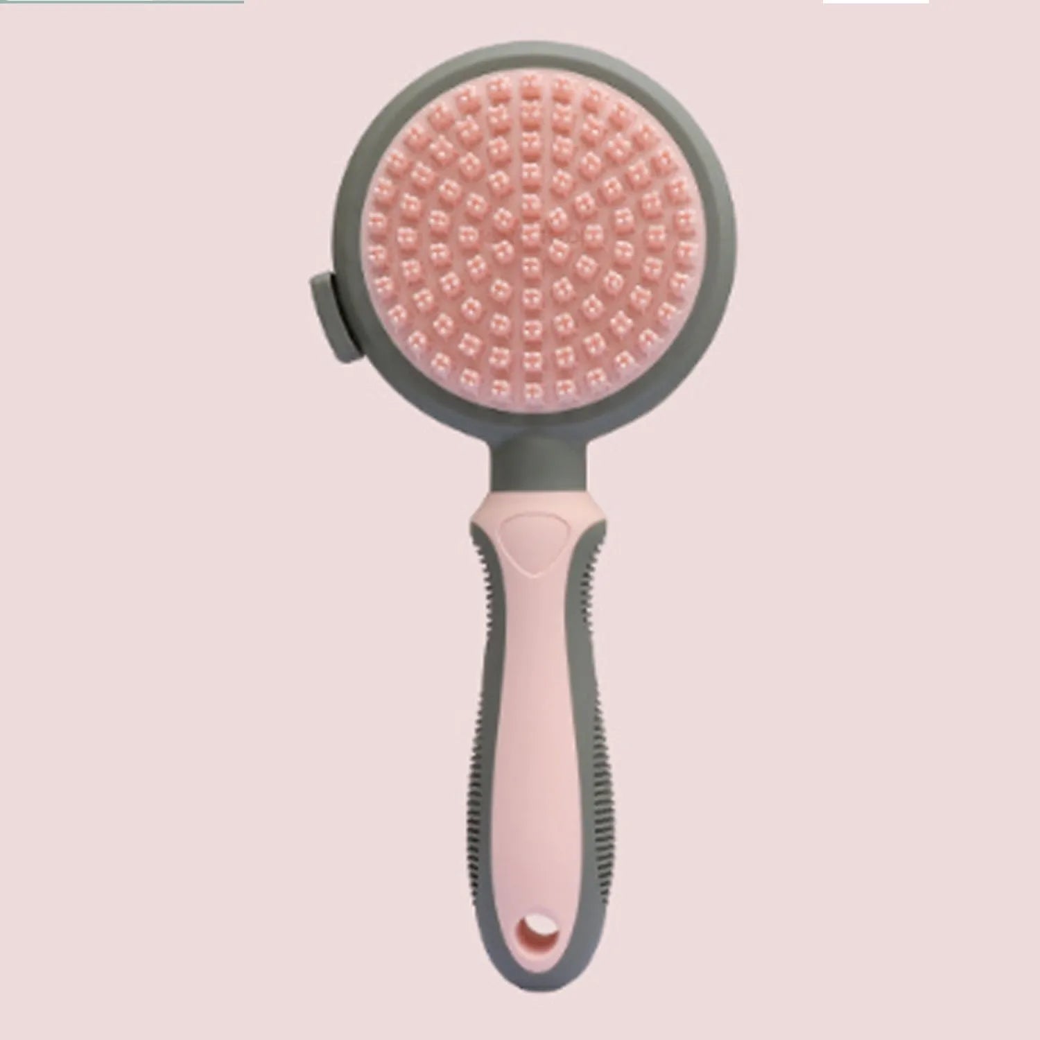 Double-sided pink cat brush with flea comb on reverse side and release button