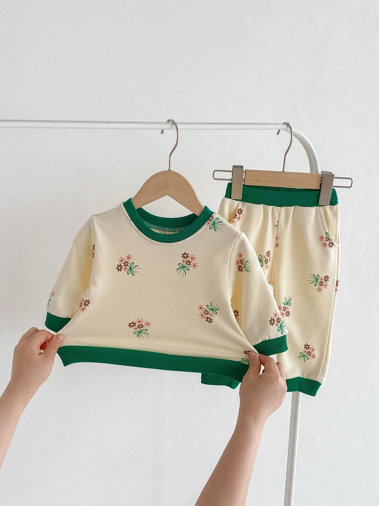 Baby cotton suit set in green with long sleeves and pants, front view