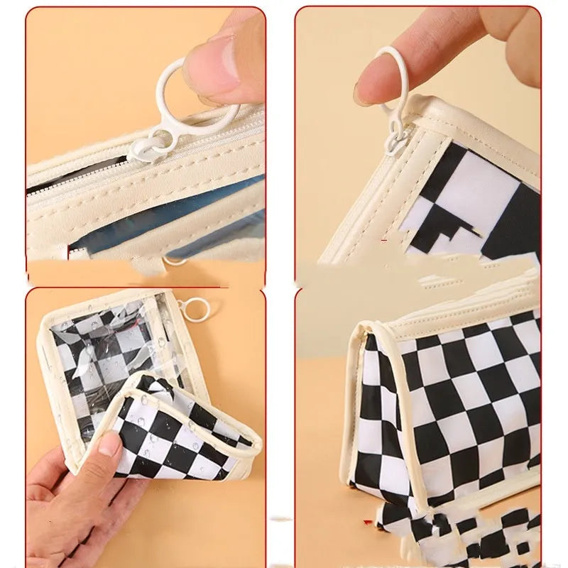 Transparent PVC pencil case with a chessboard grid pattern, showing pens inside.