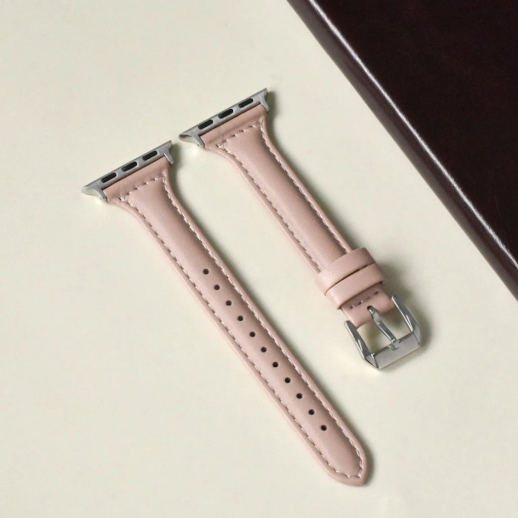 Women's retro slim leather strap for Apple Watch in cream apricot colour on a table