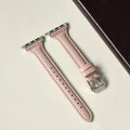 Women's retro slim leather strap for Apple Watch in cream apricot colour on a table