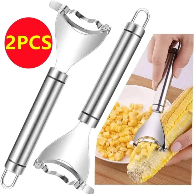 Stainless steel corn planer kitchen tool on a wooden surface