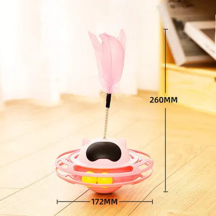 Pink cat tumbler turntable toy with rotating platform and dangling cat stick for interactive feline play