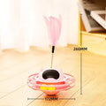 Pink cat tumbler turntable toy with rotating platform and dangling cat stick for interactive feline play