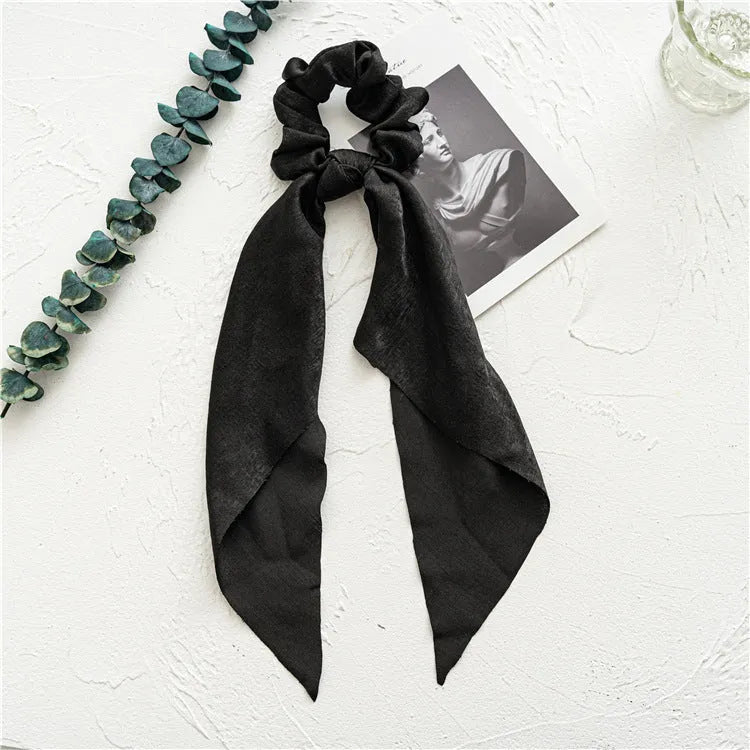 Long cloth ribbon hair tie in spring dark green colour with large intestine ring shape for ponytail or bandeau styling
