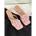 Women's sandals with chunky heel, square toe, flower embellishment on satin strap in cream-white colour