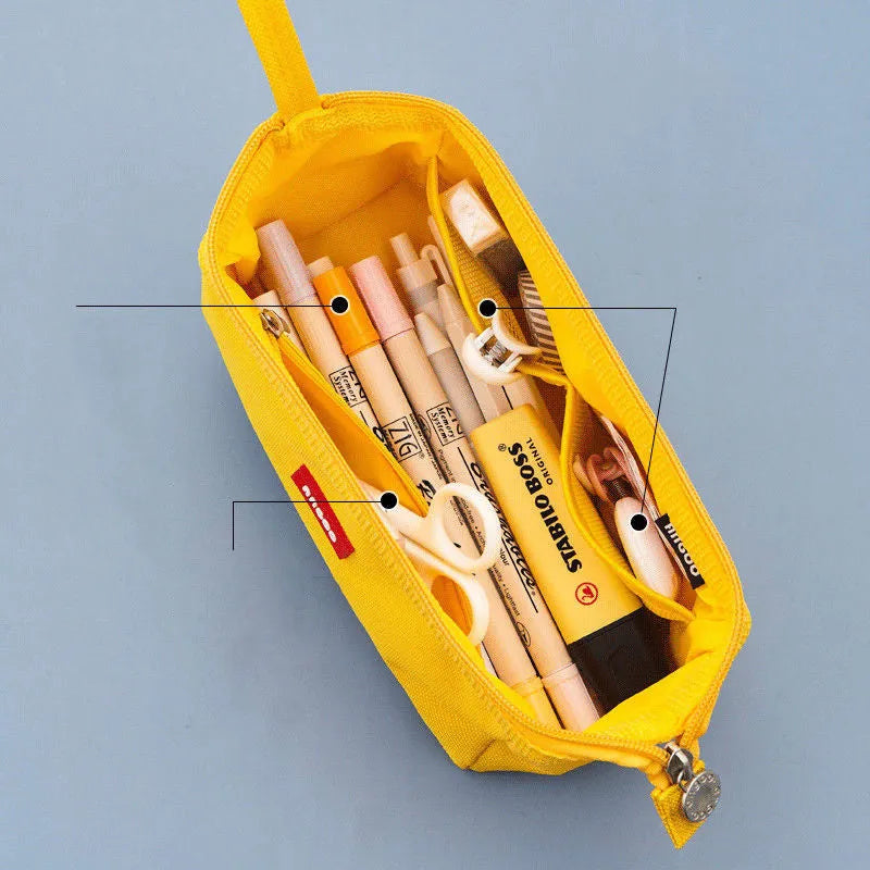 Large-capacity oxford cloth pencil case with a double zipper, shown in yellow, black, and dark blue colour options.